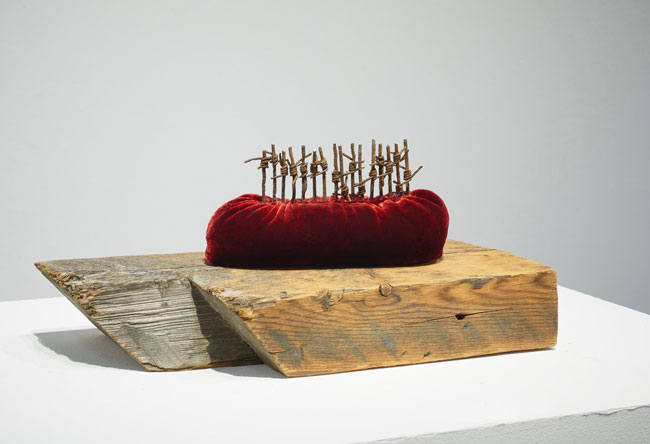 Boat People 2017; reclaimed military barbed wire, silk velvet, found wood
