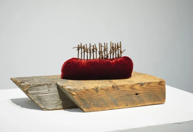 Boat People 2017; reclaimed military barbed wire, silk velvet, found wood