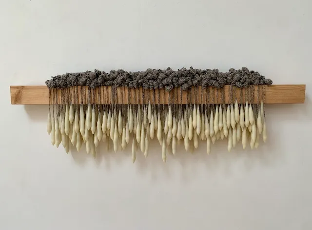 Drop II, wax, wool, wood, elastic cord