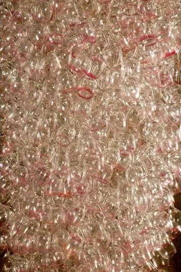 Here Come the Girls 2009

Manchester Art Gallery Atrium

1100 Wine Glasses

Lipstick

Commissioned by Manchester Art Gallery to celebrate the festive season and specifically to link to their exhibition Angels of Anarchy: Women Artists and Surrealism.  The primary reference is to Meret Oppenheim's iconic fur teacup, saucer and spoon, Object.  In a contemporary culture where women are just as likely to drink wine as tea the vessel still functions as a metaphor for the female body, but in the 21st century sexual politics have evolved.

Each glass is individually rimmed with lipstick using the artist's lips.  Cosmetics, particularly lipstick, are often advertised as a way to enhance feminine power and choice, and one cosmetic company even used the slogan 'It's not makeup, it's ammunition'.

<em>"While thinking of 'strong women' femininity, power and Christmastime, I was reminded of the recent Boots TV commercials with crowds of women getting glammed up and marching out to celebrate to the Sugababes 'Here come the Girls'."</em>  Susie MacMurray

The work offers a space for rumination on the evolution of feminism and perceptions of female power/empowerment in it's various guises – cultural/political/sexual.  Also on the different ways women choose to exercise that empowerment (including binge drinking), the ambiguities it throws up, and psychological bargains we strike with ourselves.