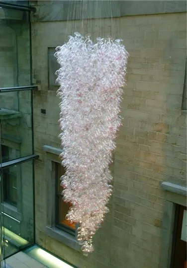 Here Come the Girls 2009

Manchester Art Gallery Atrium

1100 Wine Glasses

Lipstick

Commissioned by Manchester Art Gallery to celebrate the festive season and specifically to link to their exhibition Angels of Anarchy: Women Artists and Surrealism.  The primary reference is to Meret Oppenheim's iconic fur teacup, saucer and spoon, Object.  In a contemporary culture where women are just as likely to drink wine as tea the vessel still functions as a metaphor for the female body, but in the 21st century sexual politics have evolved.

Each glass is individually rimmed with lipstick using the artist's lips.  Cosmetics, particularly lipstick, are often advertised as a way to enhance feminine power and choice, and one cosmetic company even used the slogan 'It's not makeup, it's ammunition'.

<em>"While thinking of 'strong women' femininity, power and Christmastime, I was reminded of the recent Boots TV commercials with crowds of women getting glammed up and marching out to celebrate to the Sugababes 'Here come the Girls'."</em>  Susie MacMurray

The work offers a space for rumination on the evolution of feminism and perceptions of female power/empowerment in it's various guises – cultural/political/sexual.  Also on the different ways women choose to exercise that empowerment (including binge drinking), the ambiguities it throws up, and psychological bargains we strike with ourselves.