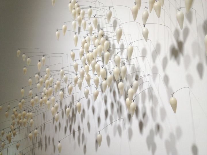 Siblings 2013; dimensions variable, fish hooks, wax, steel pins