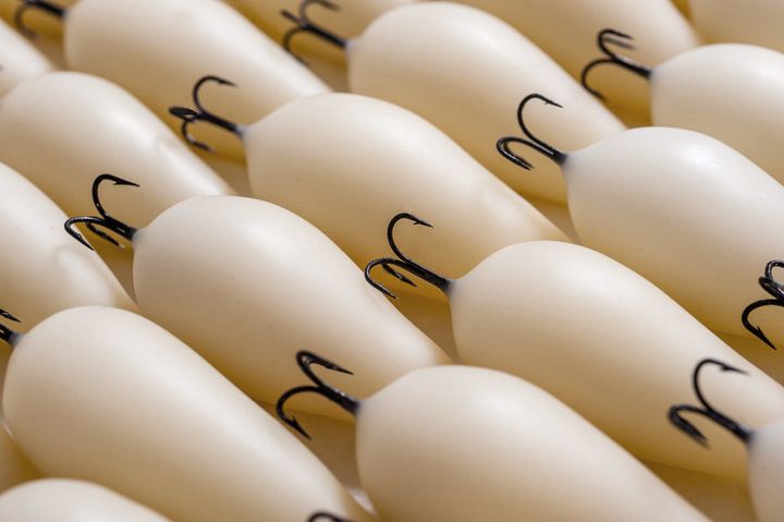 Siblings 2013; dimensions variable, fish hooks, wax, steel pins